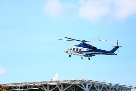helicopter parking landing on offshore platform, Helicopter transfer crews or passenger to work in offshore oil and gas industry, air transportation for support passenger, ground service in airport.のeditorial素材