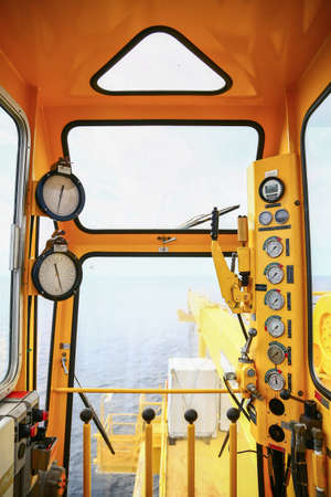 Crane construction on Oil and Rig platform for support heavy cargo, Transfer cargo or basket on work site, Heavy industry, heavy job on the oil and gas platform, Offshore operation on the platform.の写真素材