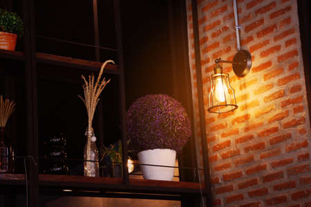 Vintage or retro lamp on old wall in home, Feeling romantic in old home with retro light, Lighting equipment in interior home with dark light picture style, Retro or vintage design lighting equipment.の写真素材