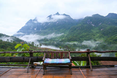 Landscape mountain and forest in the nature with cloud, People walking in the green forest and the big mountain which feeling good in holiday and haven't found in the city life.の写真素材