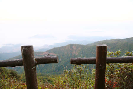 Landscape mountain and forest in the nature with cloud, People walking in the green forest and the big mountain which feeling good in holiday and haven't found in the city life.の写真素材