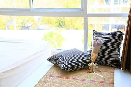 Relax corner and interior with warm light from the sun. Relax day in bedroom on free day. Feeling relax and feeling enjoy on the bed in modern bedroom. modern interior and furniture in home.の写真素材