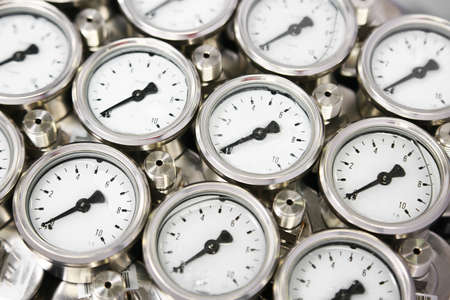 Pressure gauge using measure the pressure in production process. Worker or Operator monitoring oil and gas process by the gauge for routine record and analysis oil and gas production process.の写真素材