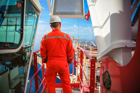 Offshore oil and gas industry and operated by technician petroleum. Worker walking to oil and gas plant for work as routine plan. Maintenance and Operation work scope in oil and gaの写真素材