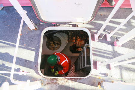 Offshore oil and gas industry and operated by technician petroleum. Worker walking to oil and gas...