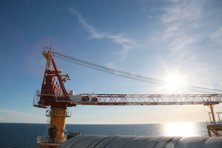 Offshore construction platform for production oil and gas. Oil and gas industry and hard work. Production platform and operation process by manual and auto functionの写真素材