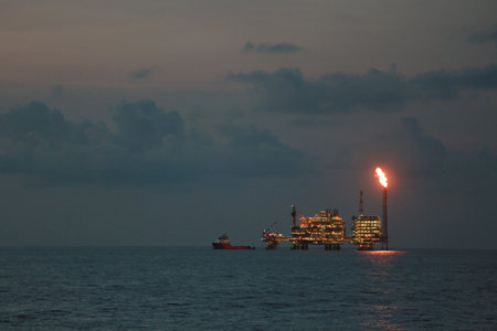 Offshore construction platform for production oil and gas. Oil and gas industry and hard work. Production platform and operation process by manual and auto functionの写真素材