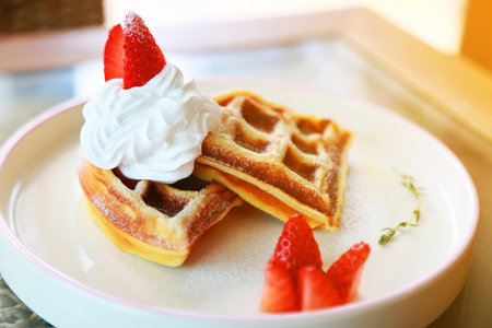 Waffle get served in the morning in the restaurant or the cafe. Food and drink set made by chef and served with hot drink. Healthy food or junk food was select by people.の写真素材