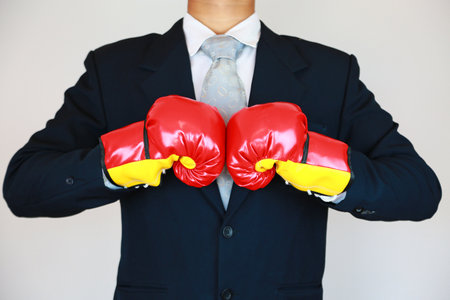 Businessman with suit and concept fight the business. Trader concept and action to fight with the business. Industry concept with businessman and acting for support presentation fiの写真素材