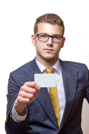 Businessman holding up white Businesscard with copy spaceの写真素材