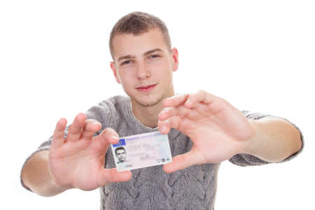16 to 18 year old boy just received his driver licenseの写真素材