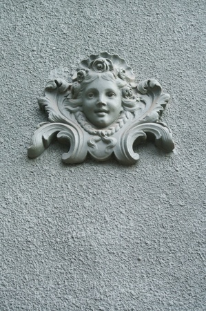 Baroque angel ornament on a wallの写真素材