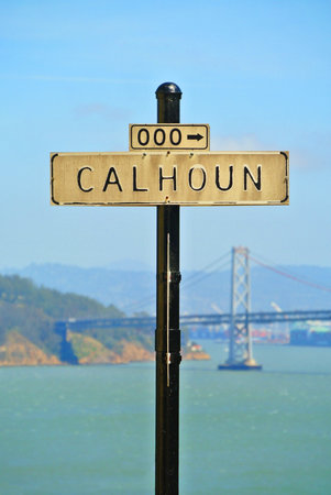 Frontal view of street sign with bridge as background in san franciscoの写真素材