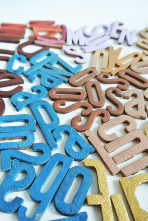 Background texture of different random letters together over whiteの写真素材