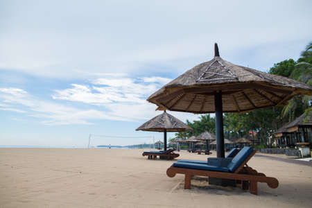 Beach Chairs on the white sand beach and with a blue skyの写真素材