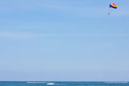 Parasailing in the blue and clear skyの写真素材
