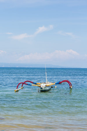 Traditional Balinese Fishing Boat on the seaの写真素材