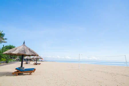 Beach Chairs on the white sand beach and with a blue skyの写真素材