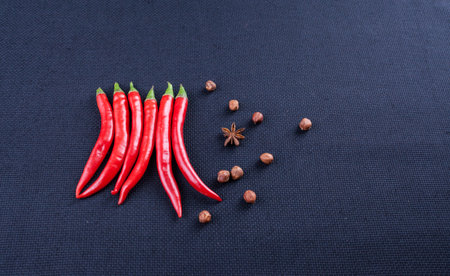 hot red pepper with nuts ot dark backgroundの写真素材