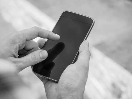 Closeup of hands using smartphone. Mockupの写真素材