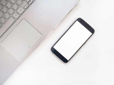 Mockup of smartphone with blank screen. Laptopの写真素材