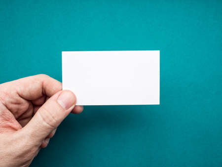 White business card Mock up in man's handの写真素材