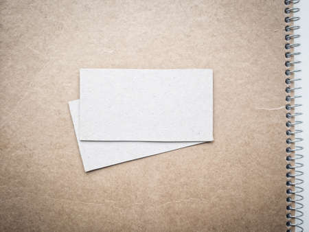 Blank business cards on notebook cover, mockupの写真素材