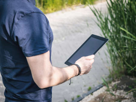 Man using digital Tablet Mockupの写真素材