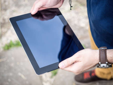 Man using digital Tablet Mockupの写真素材