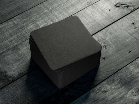 Black beverage beer coasters Mockup on the wooden tableの写真素材