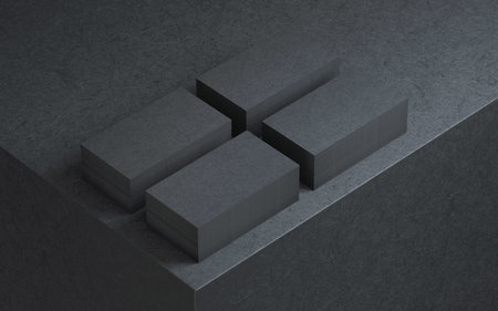 Four stacks of Black Business cards on cube