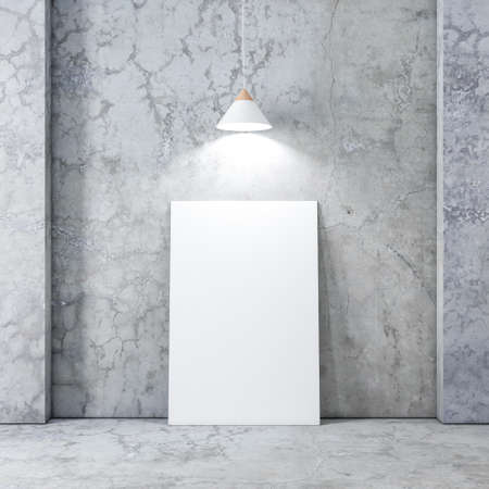 Large Poster or Canvas Mockup in empty interior with concrete wall and floor, white modern lamp above the pictureの写真素材