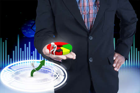 Businessman holding a pie chartの写真素材