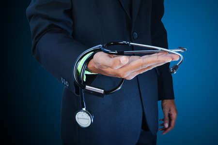 male doctor showing a stethoscopeの写真素材