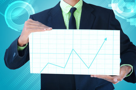 Business man showing business graph の写真素材