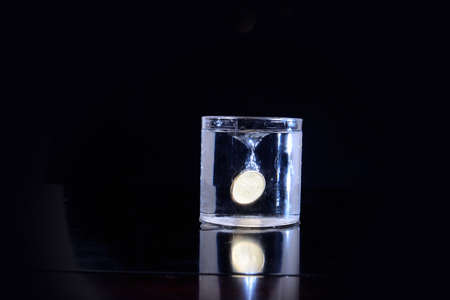 Coin dug in the waterの写真素材