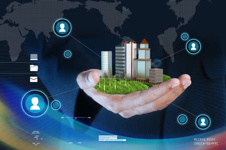 Man holding a city in handの写真素材