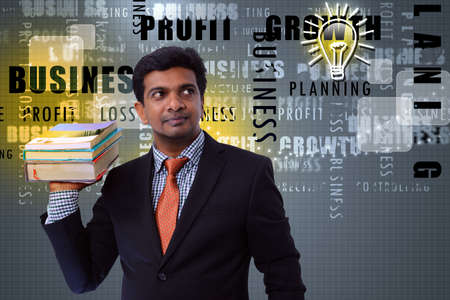 Business man with booksの写真素材