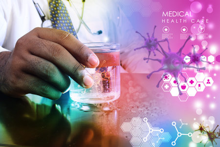 doctor hand showing virus in glass of water  