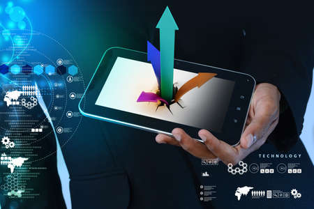 Breaking through to success as a financial graph in tabletの写真素材