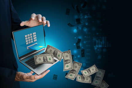 Laptop computer with a credit card, online payment conceptの写真素材