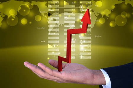 Business man showing growth graphの写真素材