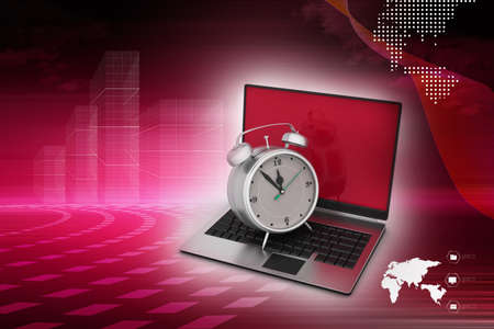 Laptop with alarm clockの写真素材