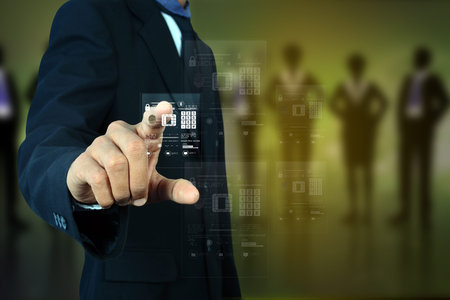 Businessman pressing virtual buttons
