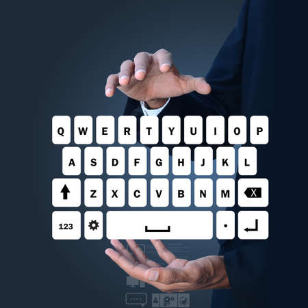 Man showing computer keysの写真素材