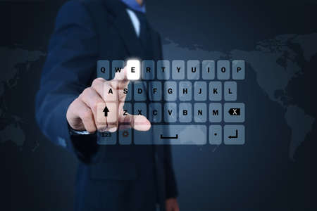 Man showing computer keysの写真素材