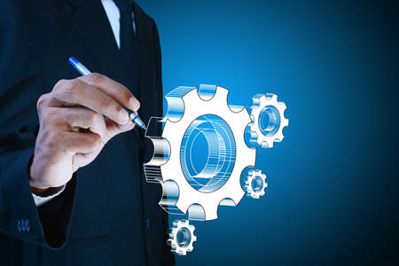 businessman showing gears cogs to success conceptの写真素材