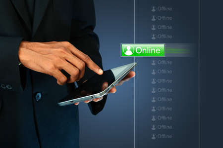 Business man with online buttonの写真素材