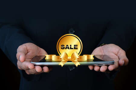 Smart hand showing sale tagの写真素材