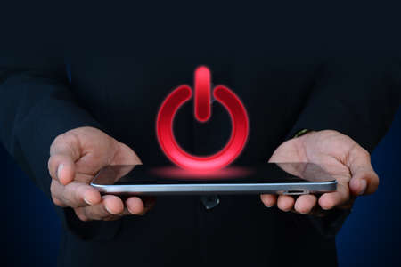 Man showing the power buttonの写真素材